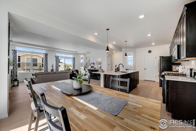 542 Highlands Cir, Erie, CO 80516 - dining room with light wood-style flooring and recessed lighting