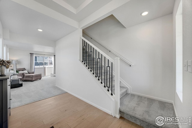 542 Highlands Cir, Erie, CO 80516 - stairs with wood finished floors, baseboards, and recessed lighting