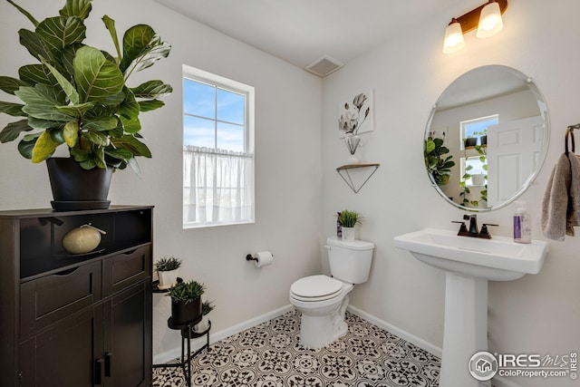 542 Highlands Cir, Erie, CO 80516 - half bath featuring baseboards and toilet