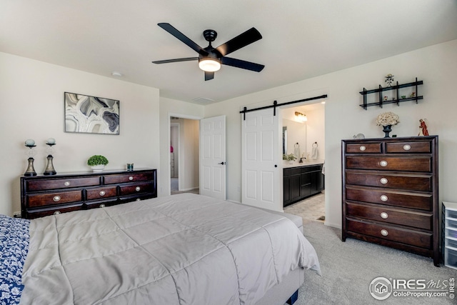 542 Highlands Cir, Erie, CO 80516 - carpeted bedroom featuring a barn door, ensuite bath, and ceiling fan