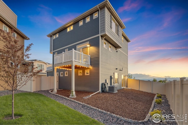 542 Highlands Cir, Erie, CO 80516 - back of house with a balcony and central air condition unit