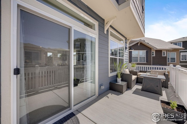 542 Highlands Cir, Erie, CO 80516 - view of wooden balcony with an outdoor living space with a fire pit and a deck