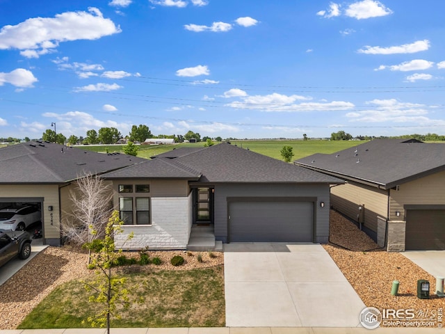 6752 Castello St, Timnath, CO 80547 - view of front of house with a garage, concrete driveway, and a shingled roof