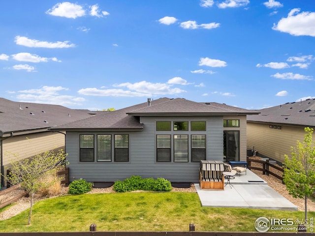 6752 Castello St, Timnath, CO 80547 - back of house with a patio, a lawn, and a shingled roof