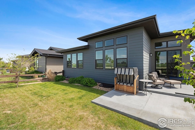 6752 Castello St, Timnath, CO 80547 - back of property featuring a patio area and a lawn