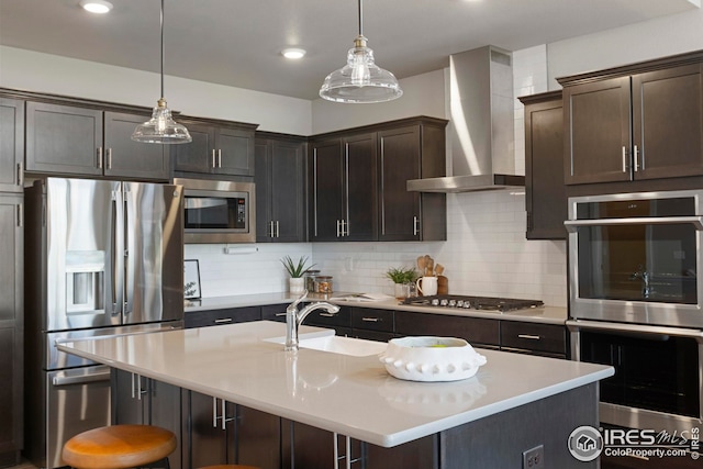 6752 Castello St, Timnath, CO 80547 - kitchen featuring stainless steel appliances, wall chimney exhaust hood, a sink, decorative backsplash, and light countertops