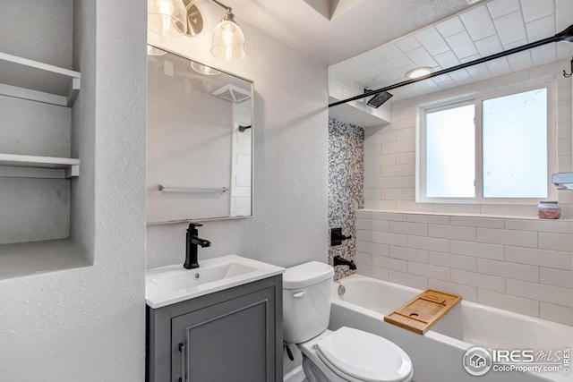 1006 4th St, Pierce, CO 80650 - bathroom with toilet, a textured wall, vanity, and shower / tub combination