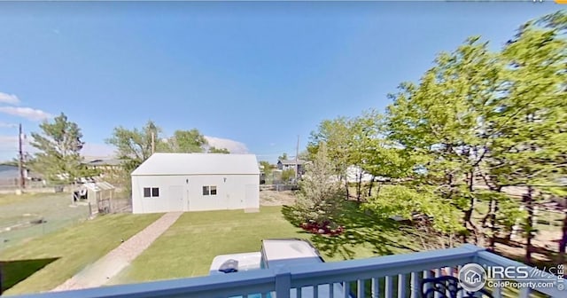 1006 4th St, Pierce, CO 80650 - back of house with a yard and an outbuilding