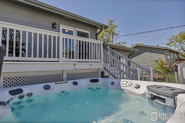 1006 4th St, Pierce, CO 80650 - view of pool featuring stairs, a hot tub, and washer / clothes dryer