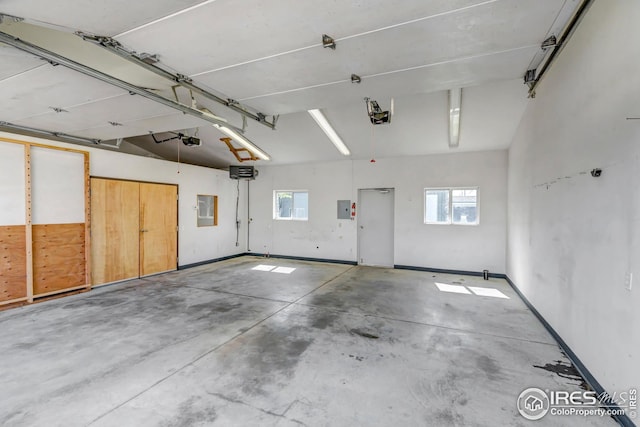 1006 4th St, Pierce, CO 80650 - garage with electric panel and a garage door opener