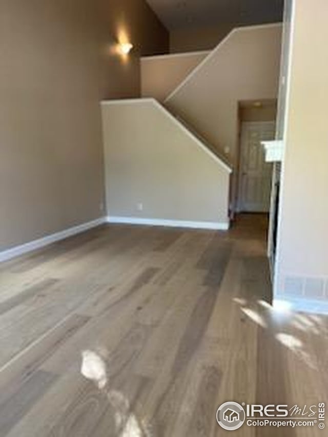 2218 Stetson Creek Dr Unit C, Fort Collins, CO 80528 - unfurnished living room with wood finished floors and baseboards