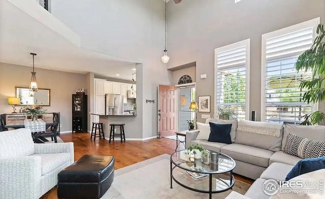 2639 County Fair Ln, Fort Collins, CO 80528 - living area with wood finished floors, baseboards, and a towering ceiling