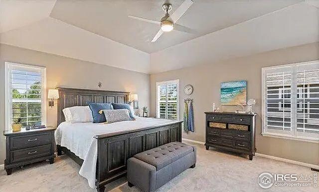 2639 County Fair Ln, Fort Collins, CO 80528 - bedroom with baseboards, light carpet, ceiling fan, and lofted ceiling