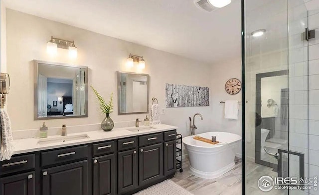 2639 County Fair Ln, Fort Collins, CO 80528 - bathroom with a stall shower, double vanity, and a freestanding tub