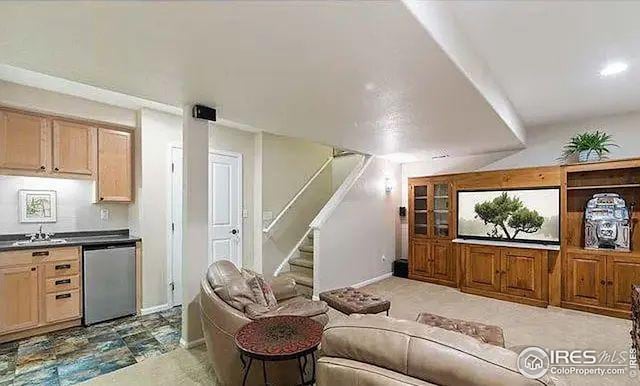 2639 County Fair Ln, Fort Collins, CO 80528 - living room featuring stairs