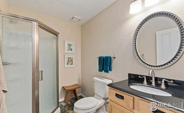 2639 County Fair Ln, Fort Collins, CO 80528 - bathroom featuring a stall shower, vanity, toilet, and baseboards