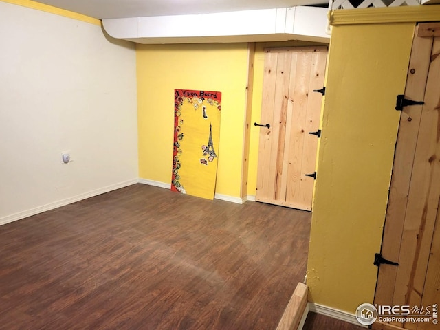 402 N Washington Ave, Fleming, CO 80728 - basement featuring wood finished floors and baseboards