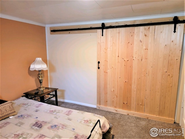 402 N Washington Ave, Fleming, CO 80728 - bedroom featuring a barn door, carpet flooring, and crown molding