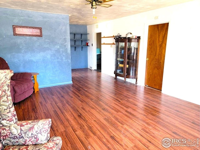 402 N Washington Ave, Fleming, CO 80728 - living room featuring wood finished floors and a ceiling fan