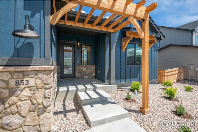 27 Snowcap Dr, Windsor, CO 80550 - entrance to property featuring stone siding and covered porch