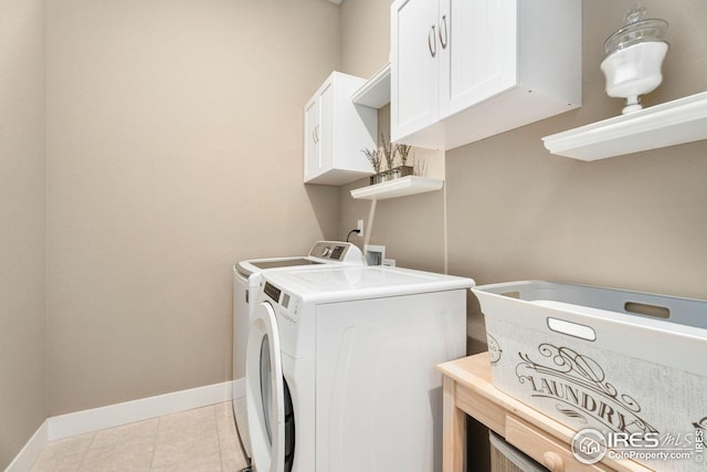 1030 Larimer Ridge Pkwy, Timnath, CO 80547 - washroom with independent washer and dryer, baseboards, cabinet space, and light tile patterned flooring