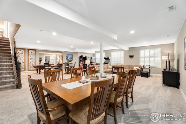 1030 Larimer Ridge Pkwy, Timnath, CO 80547 - dining space featuring light colored carpet, stairs, baseboards, and recessed lighting