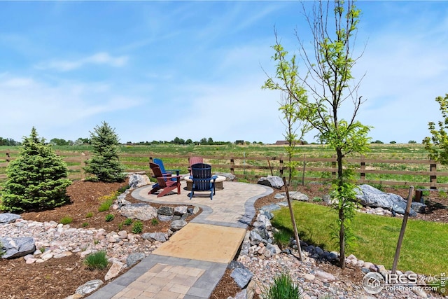 1030 Larimer Ridge Pkwy, Timnath, CO 80547 - view of yard with a fire pit, a patio area, and a view of countryside