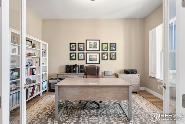 1030 Larimer Ridge Pkwy, Timnath, CO 80547 - office area with wood finished floors and baseboards