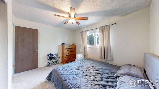 8208 Peakview Dr, Fort Collins, CO 80528 - bedroom featuring carpet flooring, a textured ceiling, and a ceiling fan
