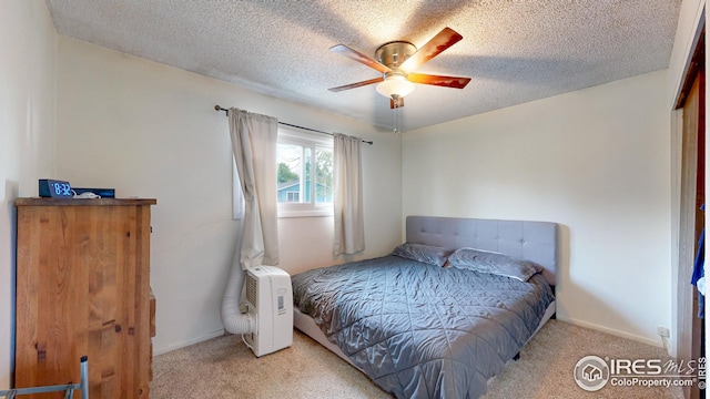 8208 Peakview Dr, Fort Collins, CO 80528 - carpeted bedroom with a textured ceiling, baseboards, and a ceiling fan