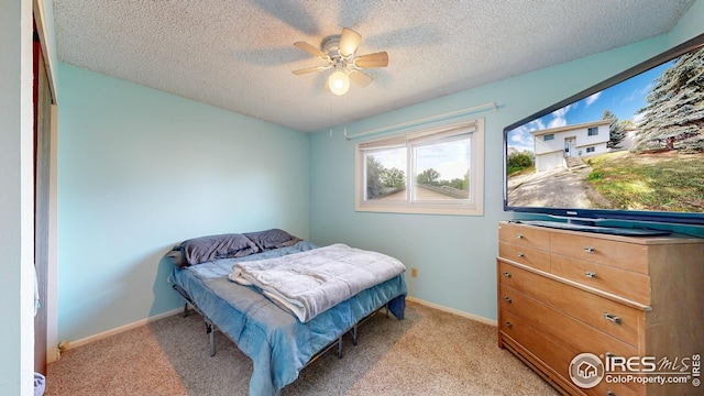 8208 Peakview Dr, Fort Collins, CO 80528 - bedroom featuring a textured ceiling, light carpet, baseboards, and a ceiling fan