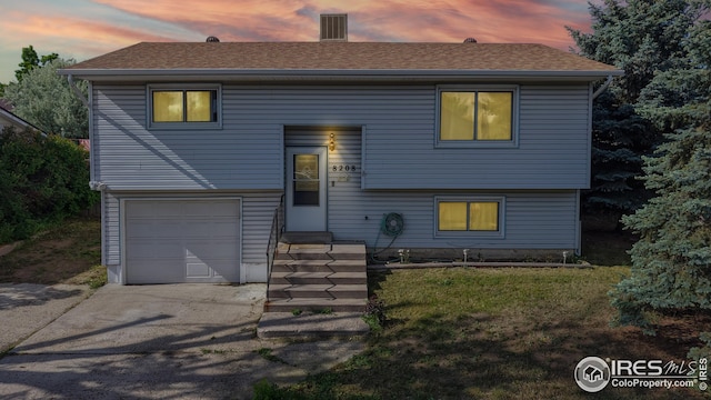 8208 Peakview Dr, Fort Collins, CO 80528 - raised ranch with an attached garage, roof with shingles, and driveway