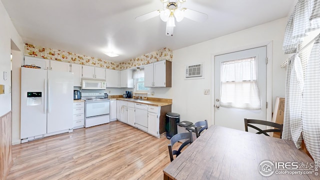 8208 Peakview Dr, Fort Collins, CO 80528 - kitchen featuring white appliances, a sink, light countertops, light wood-style floors, and ceiling fan