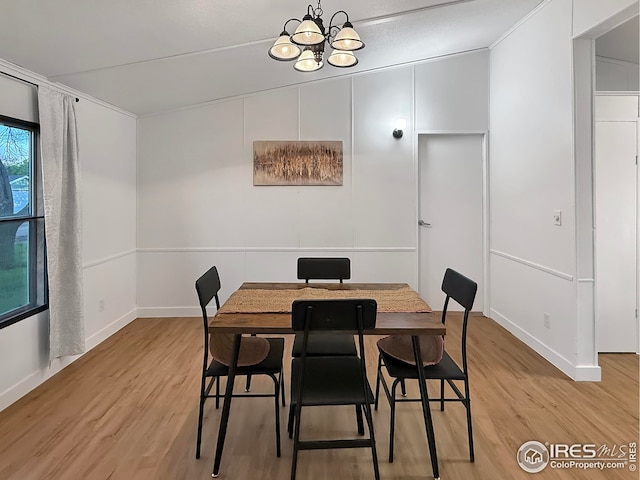 306 E Arapahoe St, Fleming, CO 80728 - dining space featuring a chandelier, light wood-style flooring, and baseboards