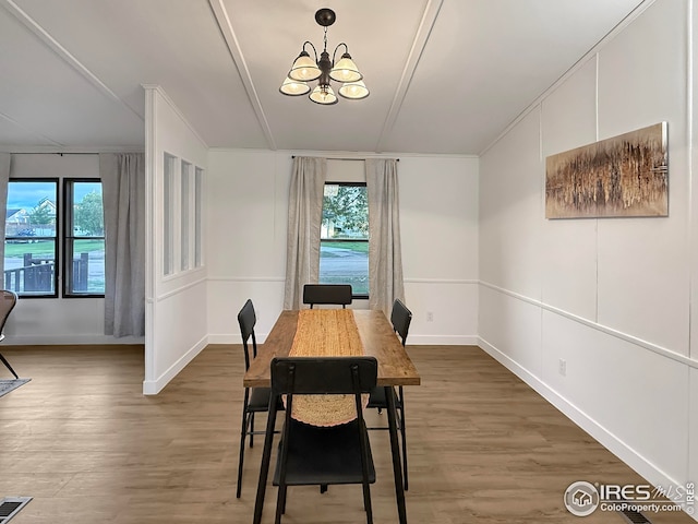306 E Arapahoe St, Fleming, CO 80728 - dining area featuring a chandelier, healthy amount of natural light, and wood finished floors