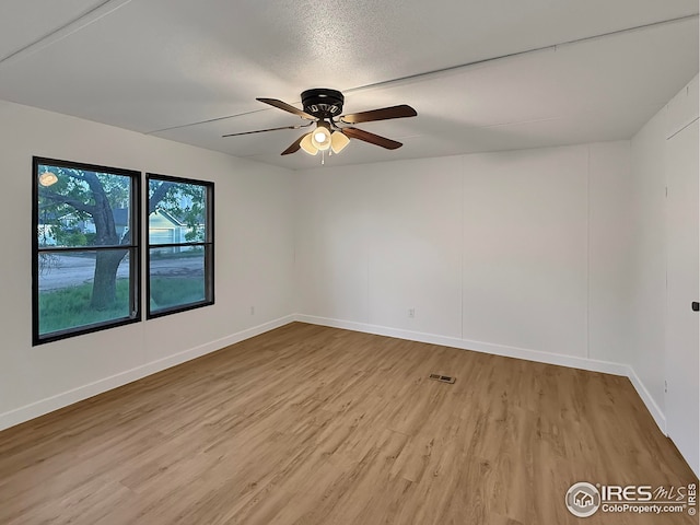 306 E Arapahoe St, Fleming, CO 80728 - unfurnished room with light wood-type flooring, ceiling fan, and baseboards