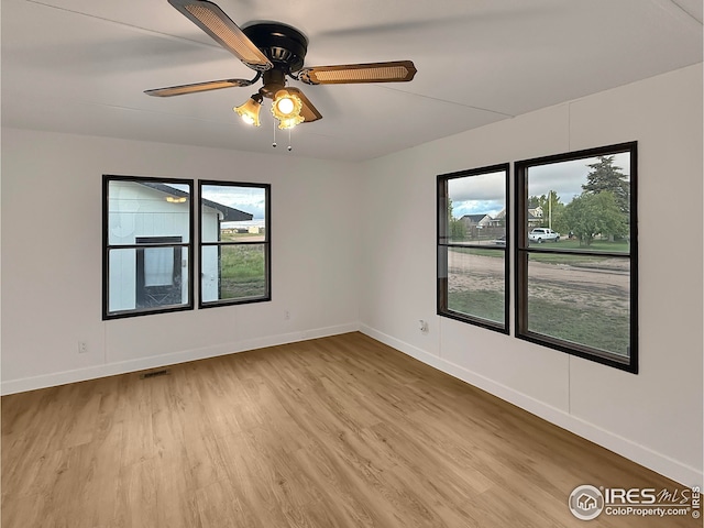 306 E Arapahoe St, Fleming, CO 80728 - spare room featuring light wood-style flooring, baseboards, and a ceiling fan