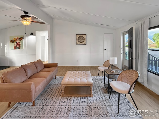 306 E Arapahoe St, Fleming, CO 80728 - living area featuring lofted ceiling, wood finished floors, a ceiling fan, and baseboards