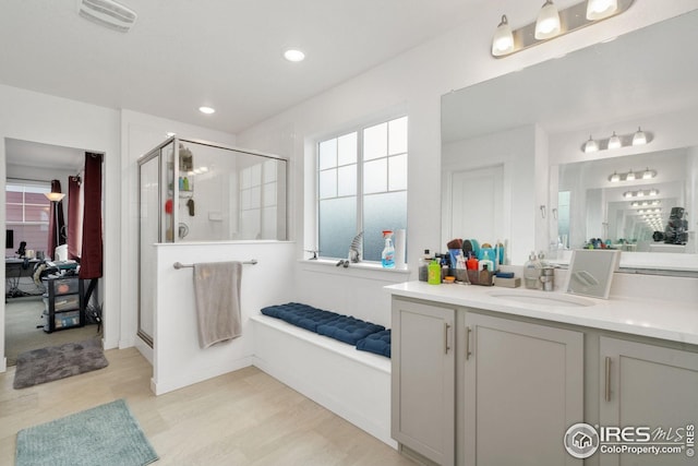 1958 Autumn Moon Dr, Windsor, CO 80550 - full bath with a shower stall, vanity, recessed lighting, and wood finished floors