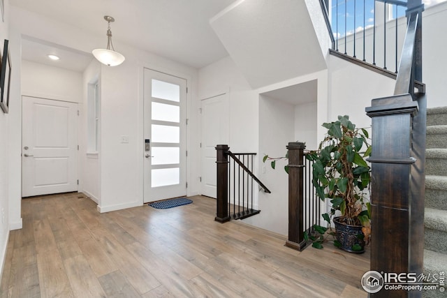1958 Autumn Moon Dr, Windsor, CO 80550 - foyer entrance with wood finished floors, plenty of natural light, and recessed lighting