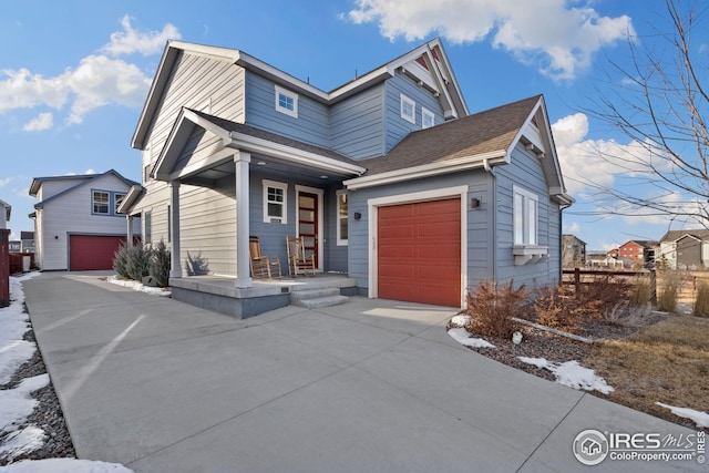 1958 Autumn Moon Dr, Windsor, CO 80550 - view of front of property with a porch, driveway, a shingled roof, and a garage