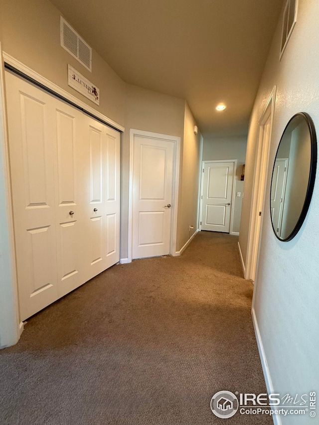 706 S Prairie Dr, Milliken, CO 80543 - hall with dark carpet, baseboards, and recessed lighting