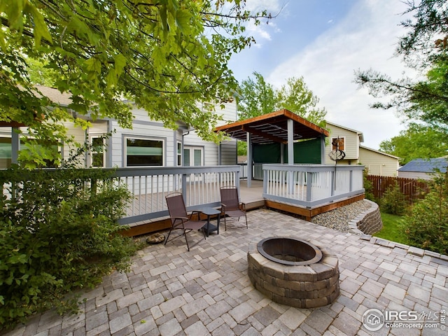 2720 E 121st Pl, Thornton, CO 80241 - view of patio / terrace featuring a fire pit and a deck