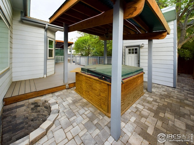 2720 E 121st Pl, Thornton, CO 80241 - view of patio / terrace featuring a hot tub and a wooden deck