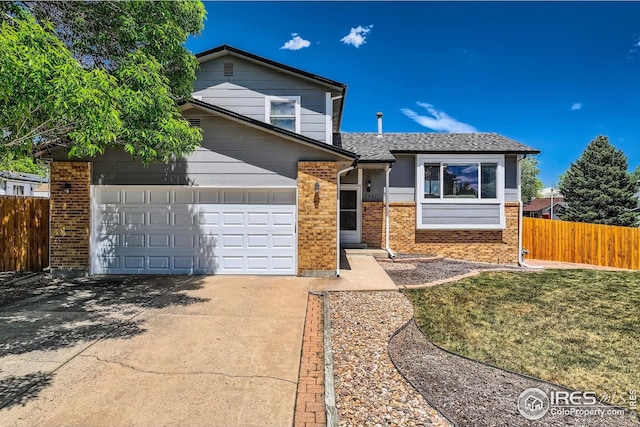 2447 E 100th Way, Thornton, CO 80229 - view of front facade with brick siding, concrete driveway, and a garage