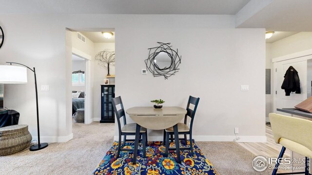 4642 Hahns Peak Dr Unit 101, Loveland, CO 80538 - dining area featuring baseboards and carpet