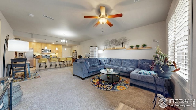 4642 Hahns Peak Dr Unit 101, Loveland, CO 80538 - living area featuring light colored carpet and a ceiling fan