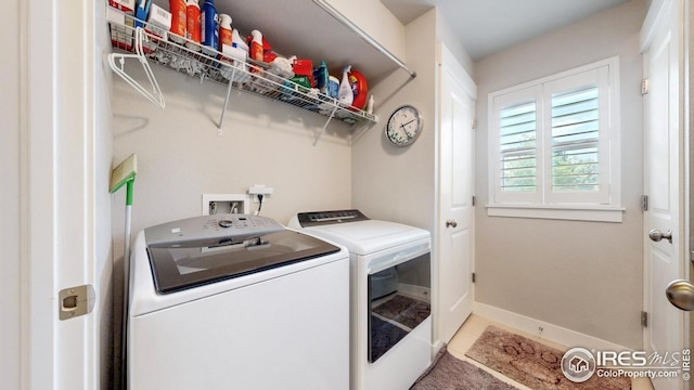 4642 Hahns Peak Dr Unit 101, Loveland, CO 80538 - laundry room with washer and dryer, baseboards, and light tile patterned floors