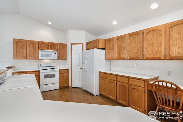 474 Radiant Dr, Loveland, CO 80538 - kitchen featuring white appliances, a sink, lofted ceiling, light countertops, and dark wood-style flooring