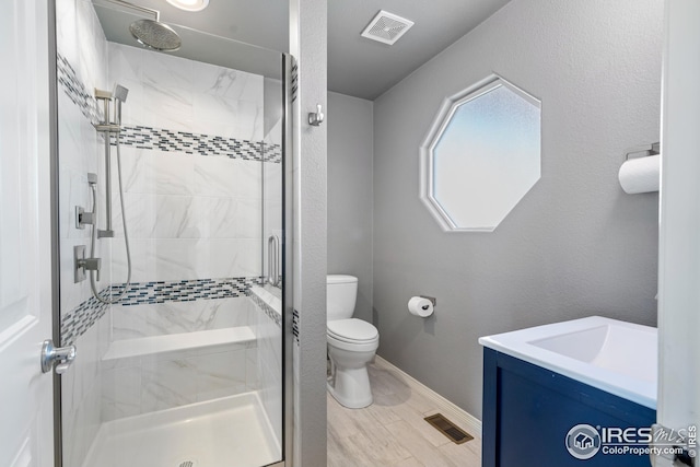 848 Shirttail Peak Dr, Windsor, CO 80550 - full bathroom with a shower stall, toilet, vanity, and baseboards